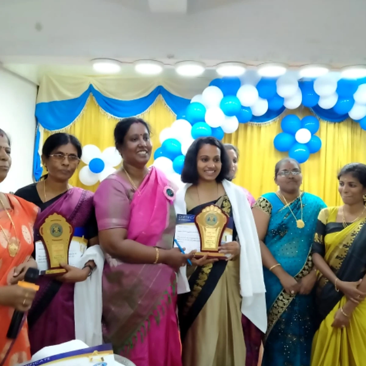 Dr. V. Nagarani with women award recipients holding trophies
