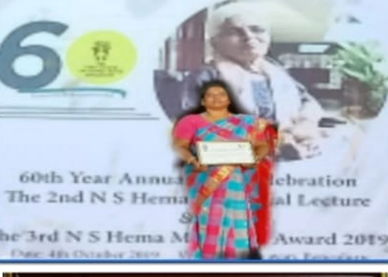 Dr. V. Nagarani with a certificate at the 60th Year Annual Celebration and N S Hema Award 2019