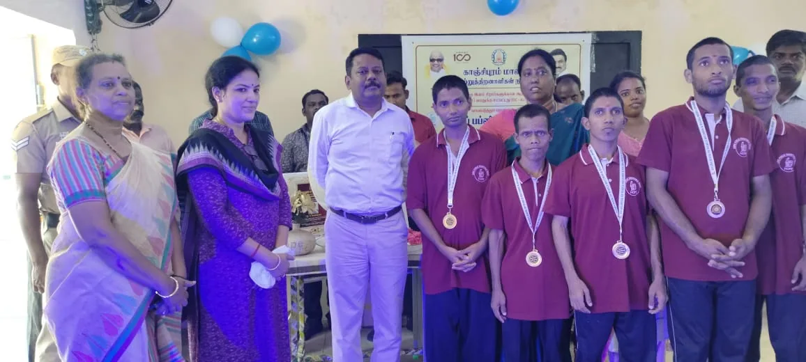 Hope Chennai students wearing medals with staff and guests after an award ceremony
