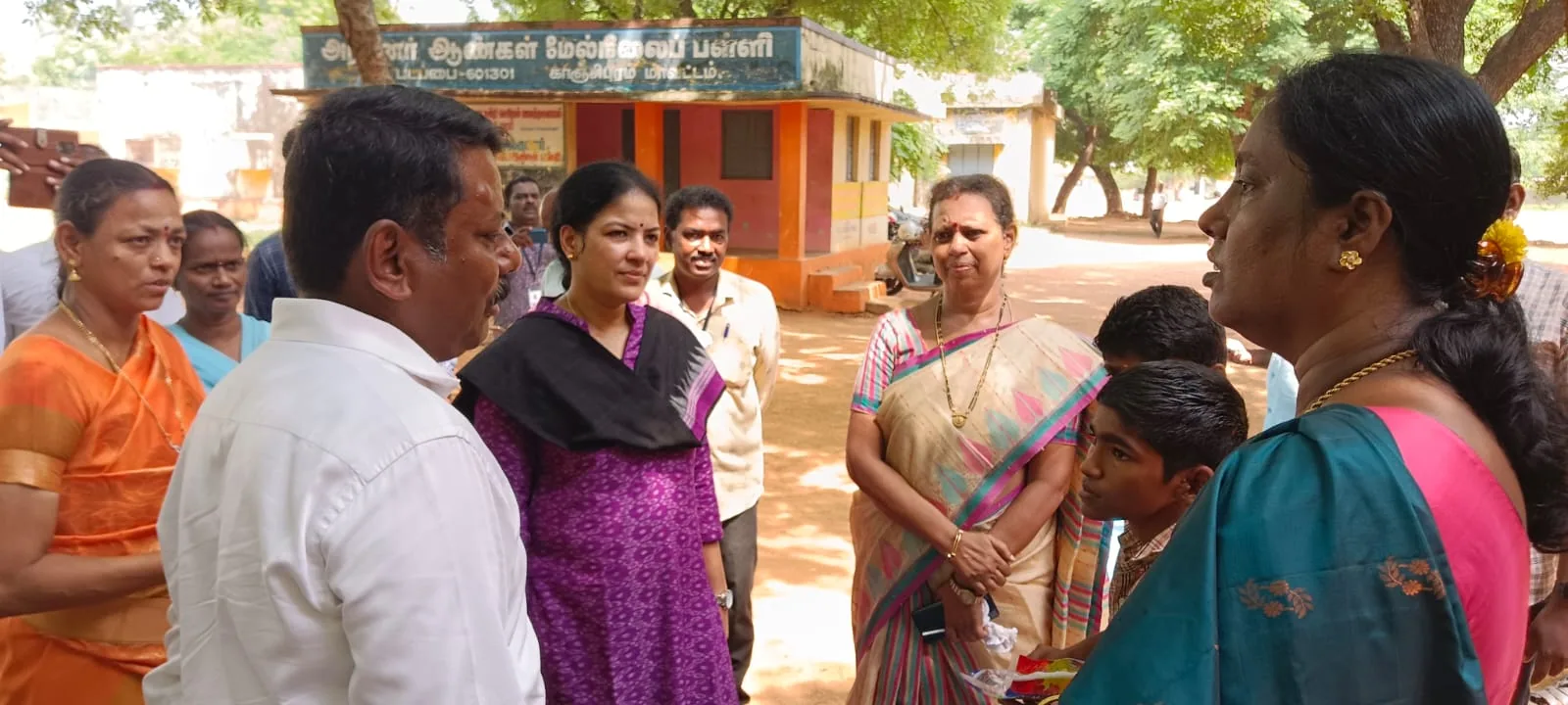 Hope Chennai staff speaking with visitors on a school campus visit