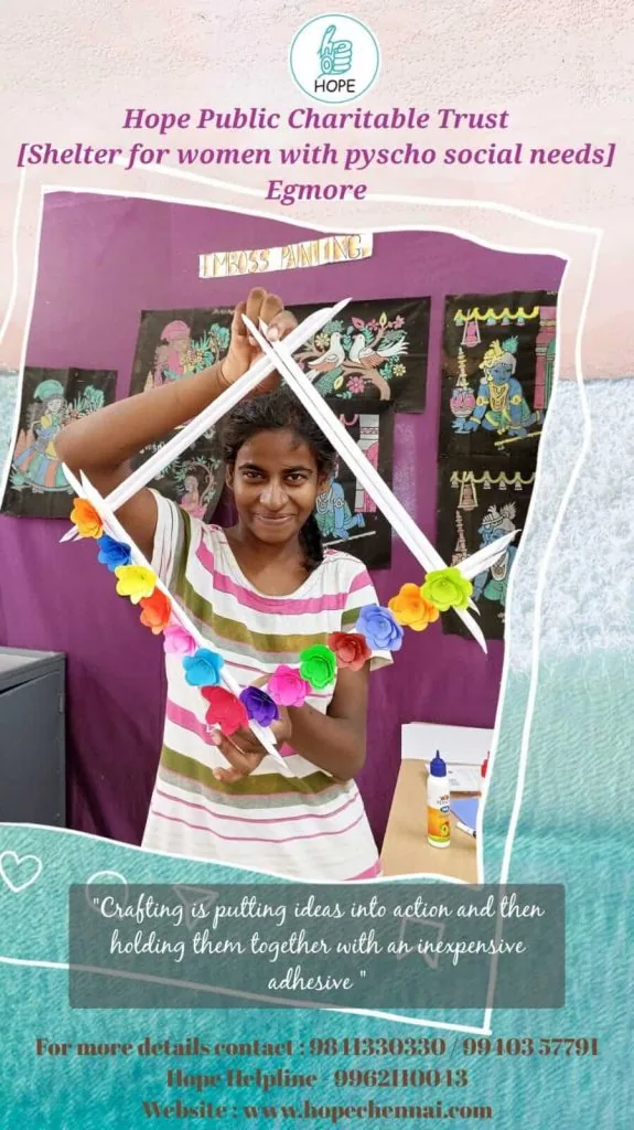 Woman at Hope Chennai's Egmore shelter holding her craft work