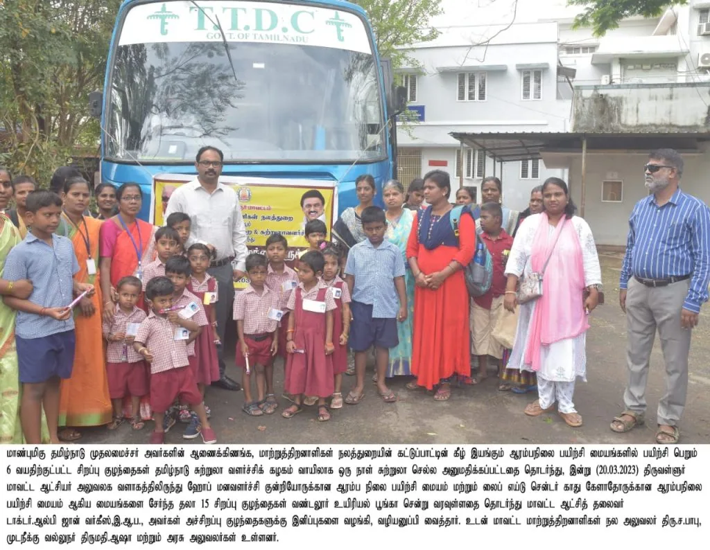 Children and staff at the launch of a special transport bus for children with disabilities