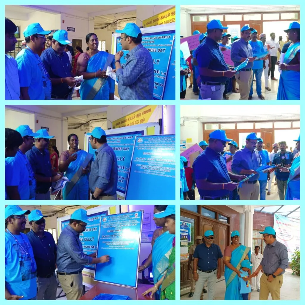 Officials signing the World Autism Awareness Day pledge board