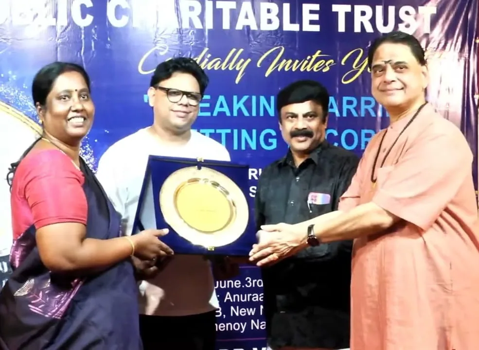 Hope Chennai founder with guests holding a memento at the Breaking Barriers event