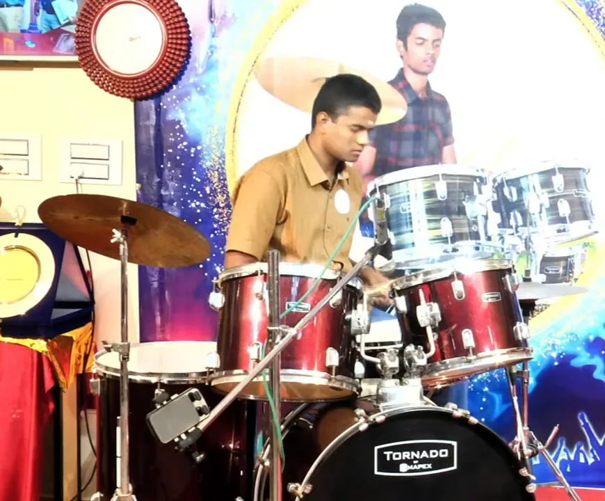 Autistic student Vishal playing the drums during his six-hour drumming marathon