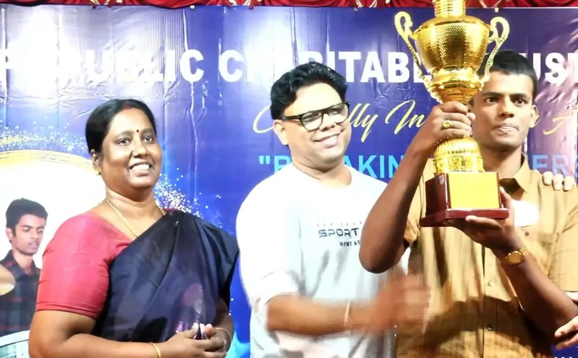 Hope Chennai student holding a trophy after the drumming world record attempt