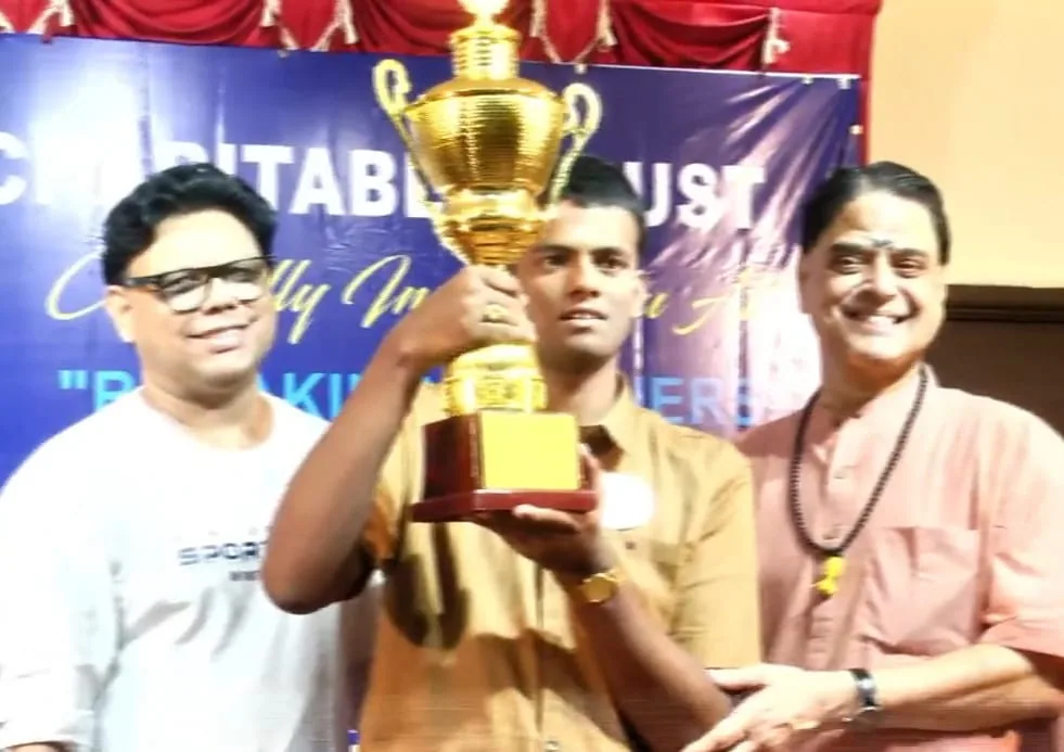 Guests presenting a trophy to the student drummer at the Breaking Barriers event