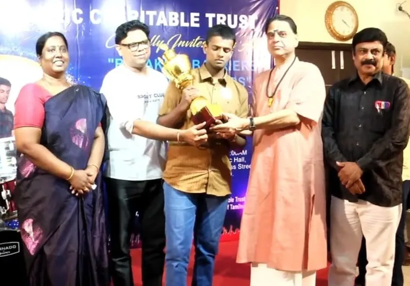 Guests on stage presenting a trophy at Hope Chennai's drumming record event