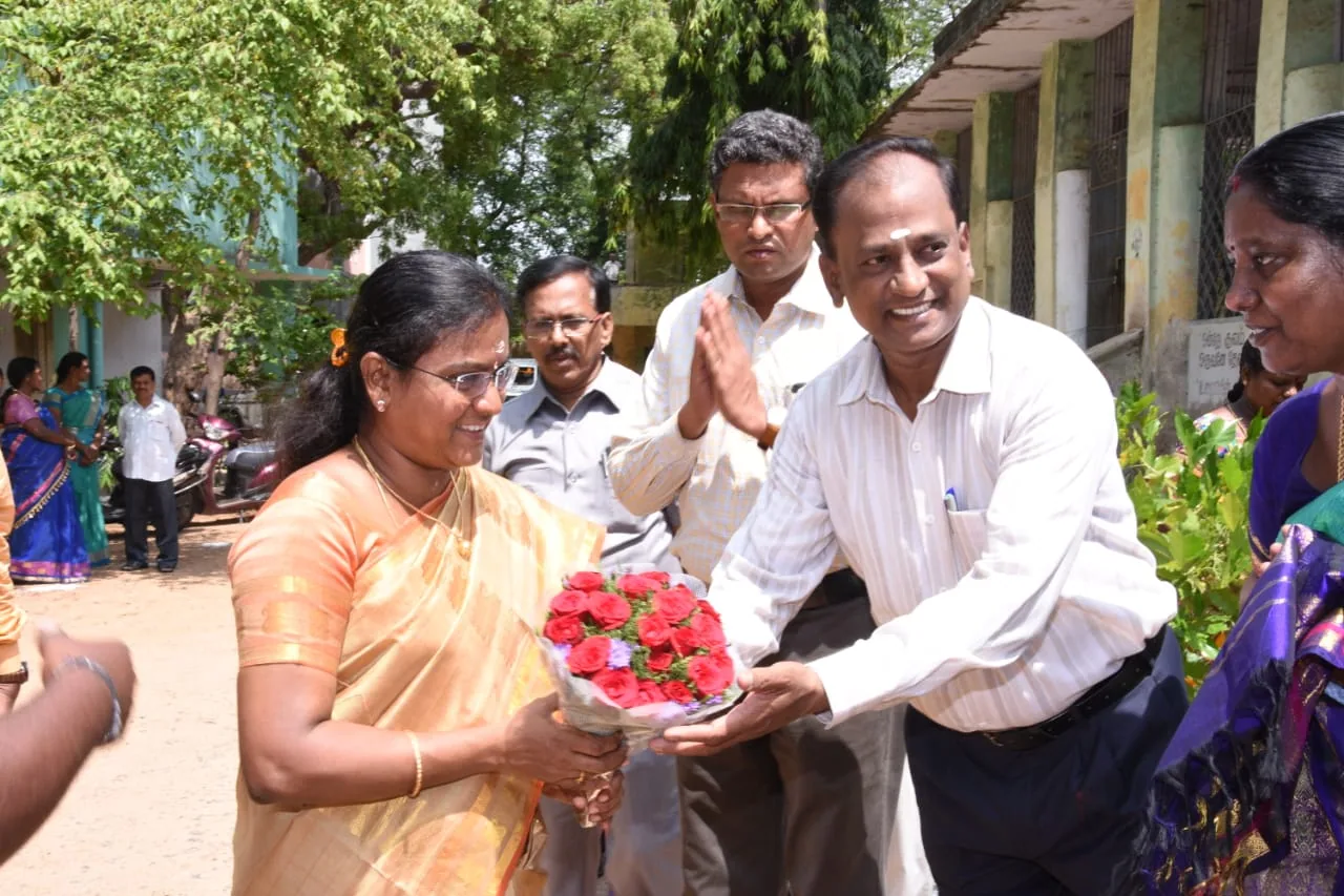 Official welcomed with a bouquet at a disability welfare department event