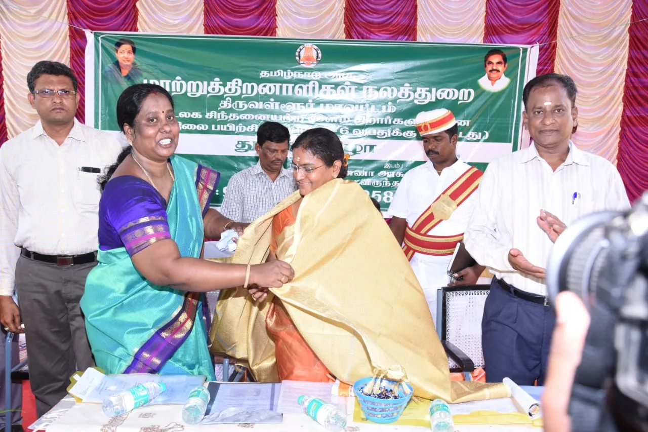 Hope Chennai founder honouring a guest with a shawl at a welfare department event