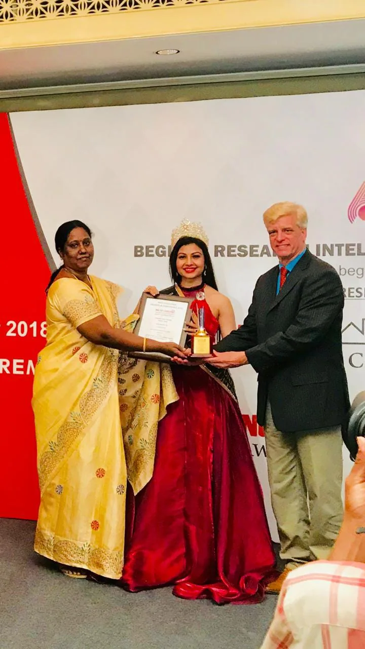 Hope Chennai founder receiving an award certificate at a ceremony