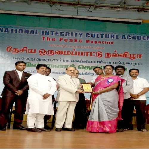 Hope Chennai founder receiving an award from the National Integrity Cultural Academy