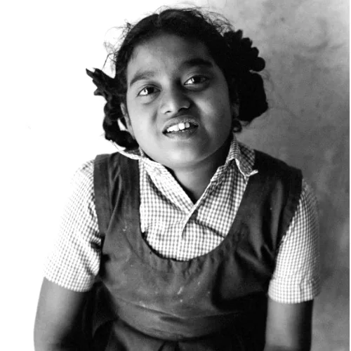 Black and white portrait of a smiling girl at Hope Special School