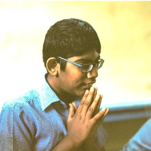 Boy at Hope Chennai with his hands folded in greeting