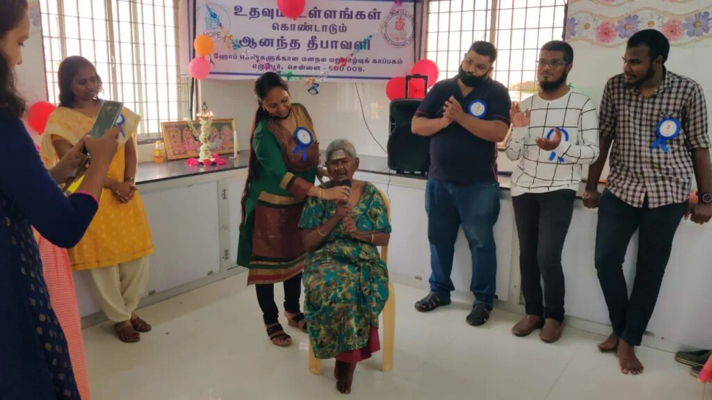 Volunteers celebrating with an elderly woman resident at Hope Chennai's shelter