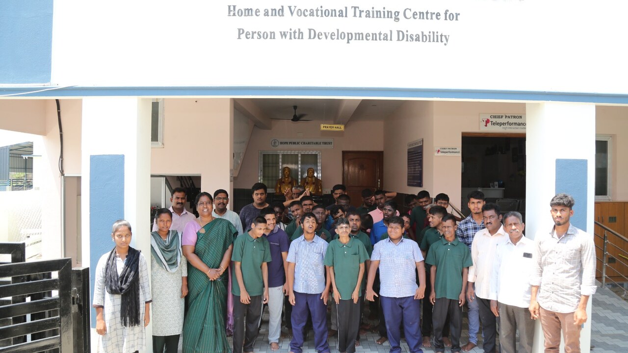 Hope Public Charitable Trust building with staff and children