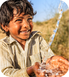 Child receiving clean water