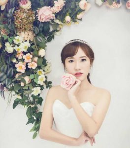 Bride holding rose